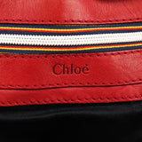 Bolso tote Patsy de piel roja con logo de tachuelas