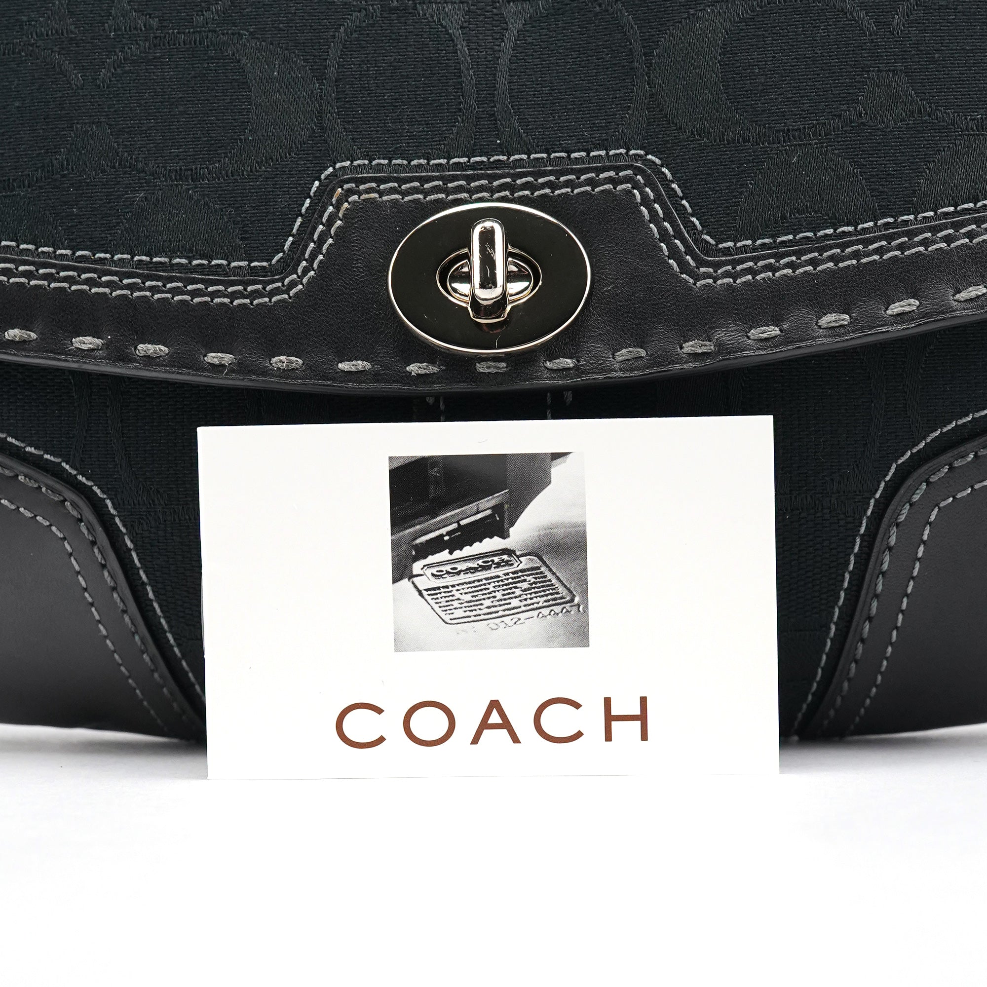 Coach Sac porté épaule à fermoir tournant en toile Signature noire