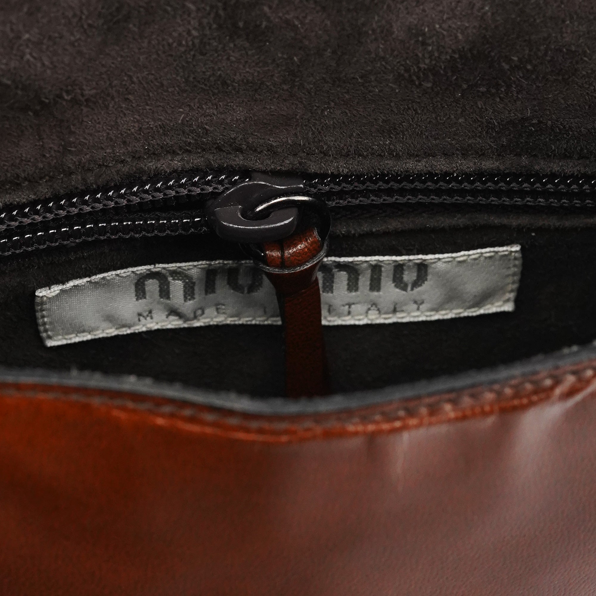 Miu Miu Sac bandoulière à rabat en cuir marron