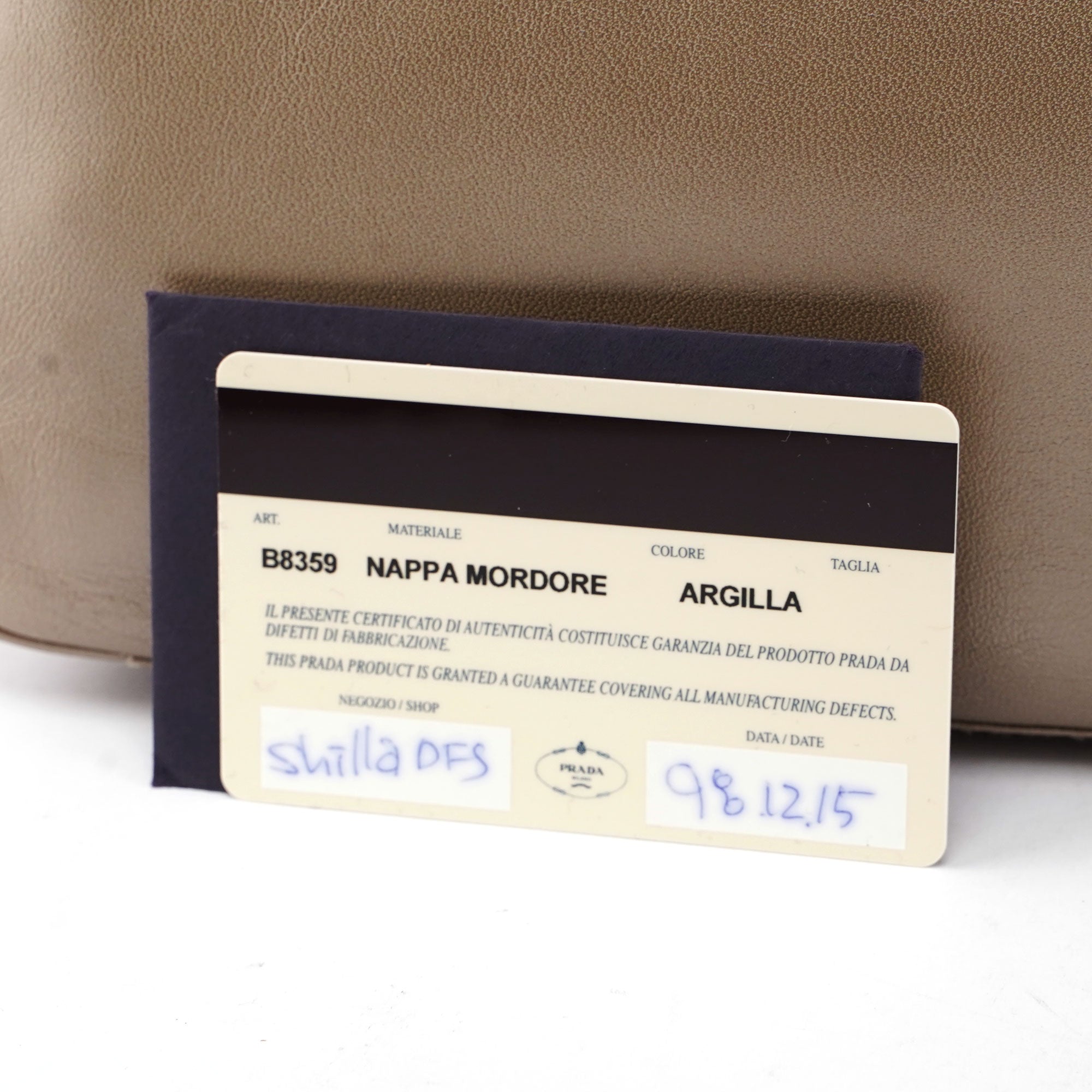 Prada Sac hobo Prada asymétrique en cuir beige