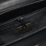 Prada Sac à poignée en cuir noir et métal doré