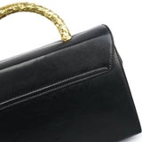 Prada Sac à poignée en cuir noir et métal doré