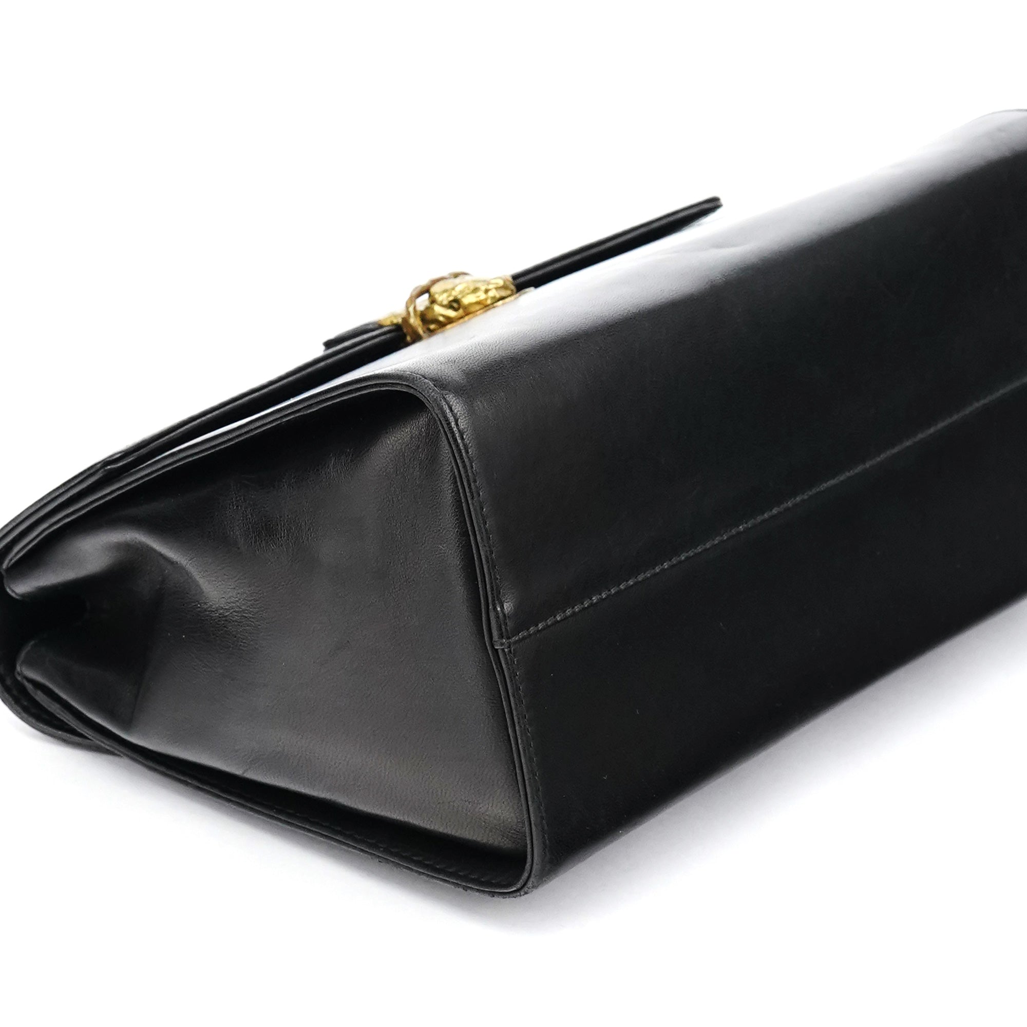 Prada Sac à poignée en cuir noir et métal doré