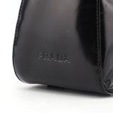 Prada Sac porté épaule Spazzolato Sport en cuir verni noir