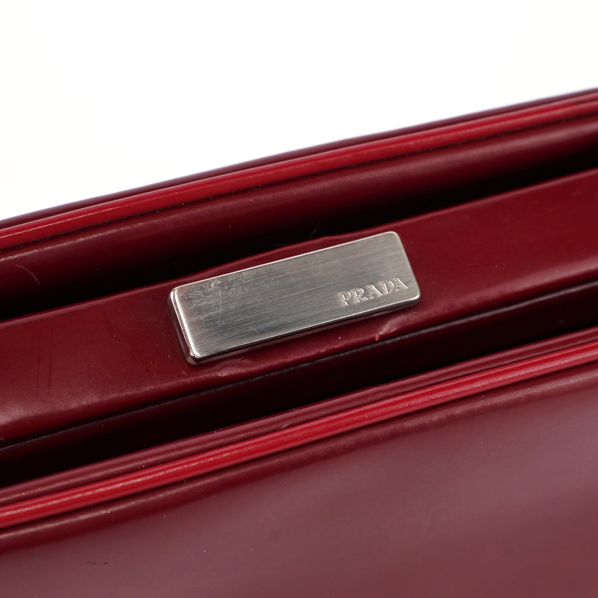 Prada Burgundy Spazzolato Top Handle Clutch Bag