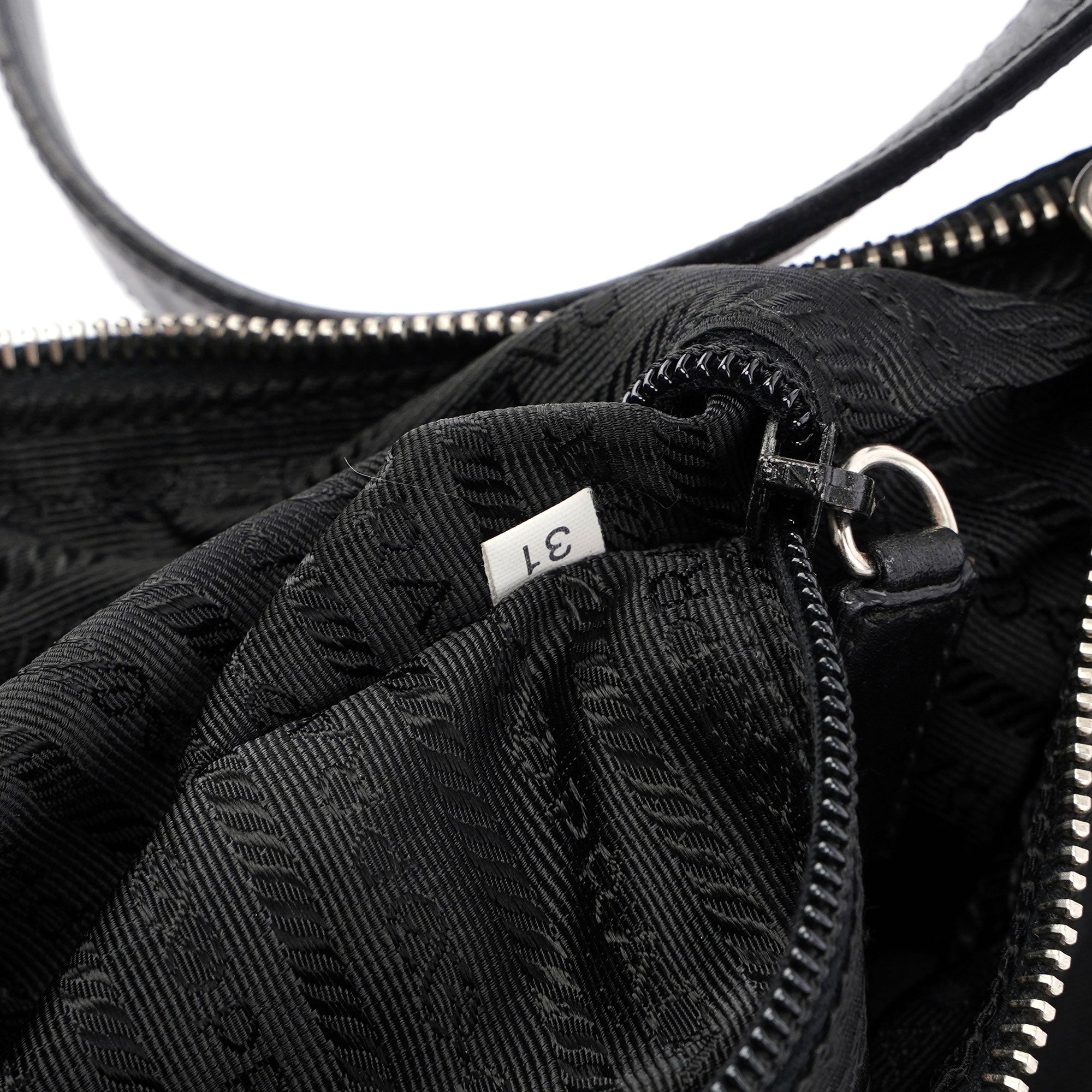 Prada Mini sac à main Prada Tessuto en nylon et cuir noirs